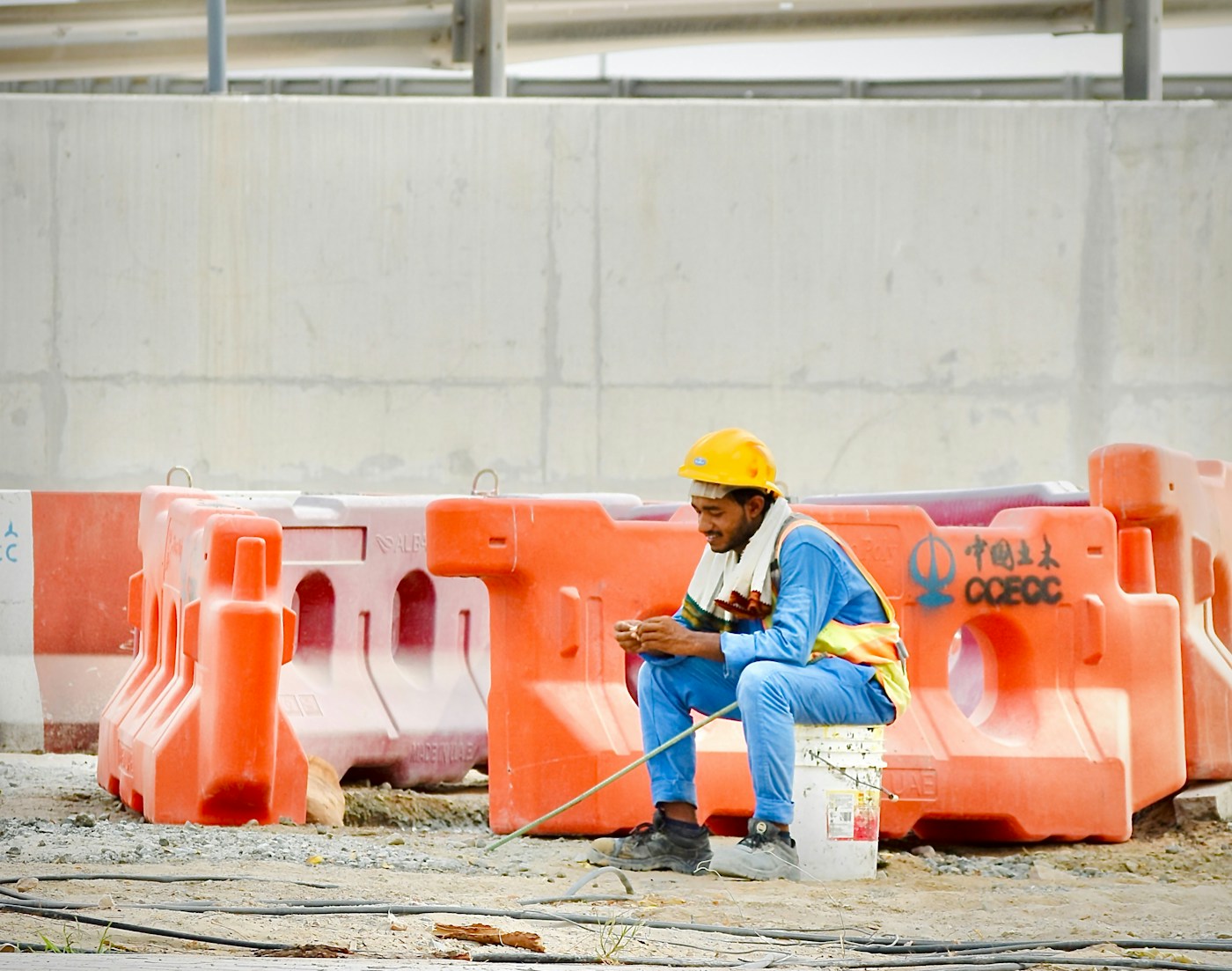 A construction worker in a hard hat on site