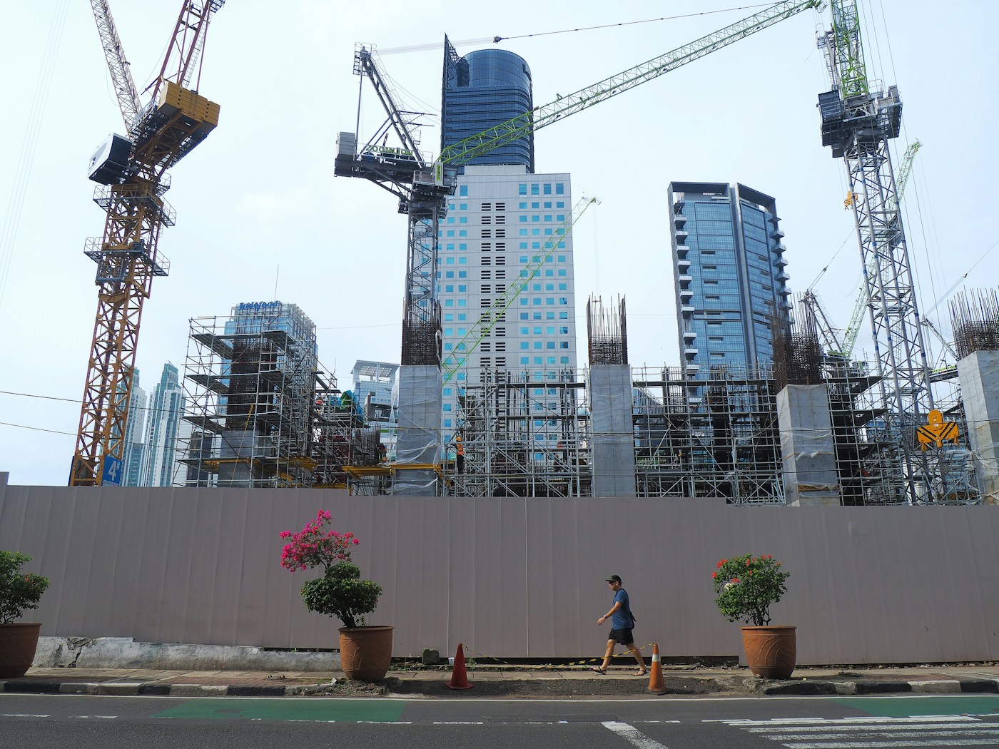 A construction site with cranes and buildings under construction