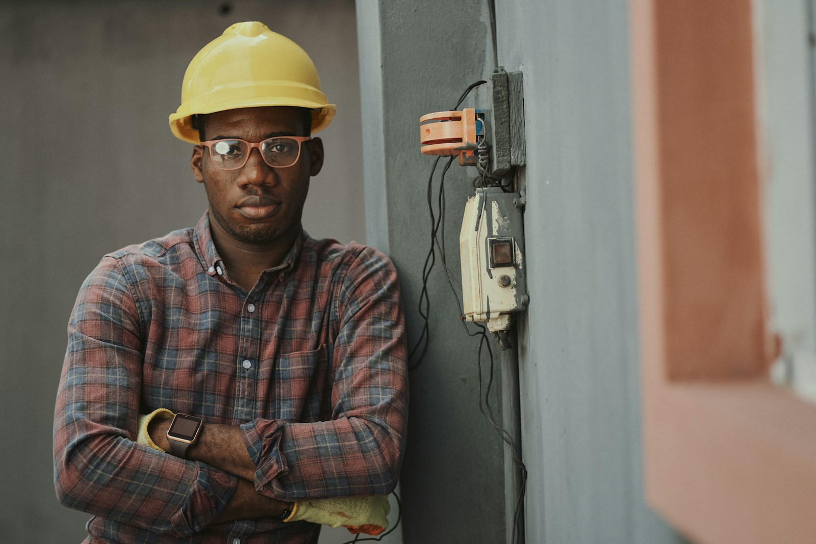 A worker in a yellow hard hat on site